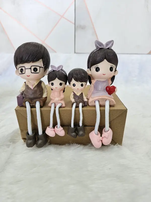 Cute Couple with Kids Hanging Legs Showpiece