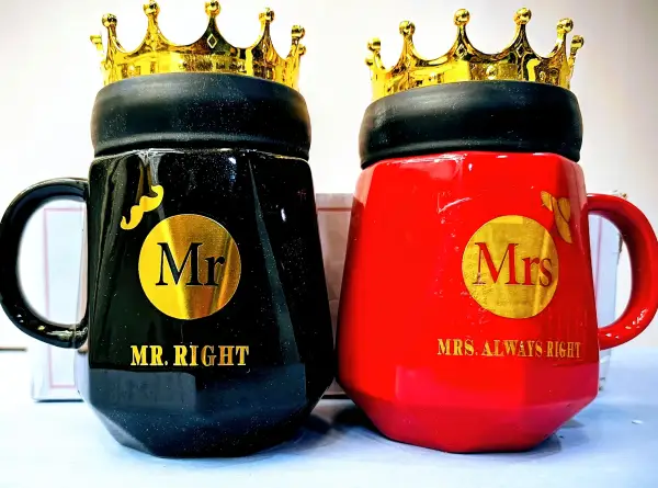 "Mr. Right" and "Mrs. Always Right" ceramic mugs with golden crown-shaped lids